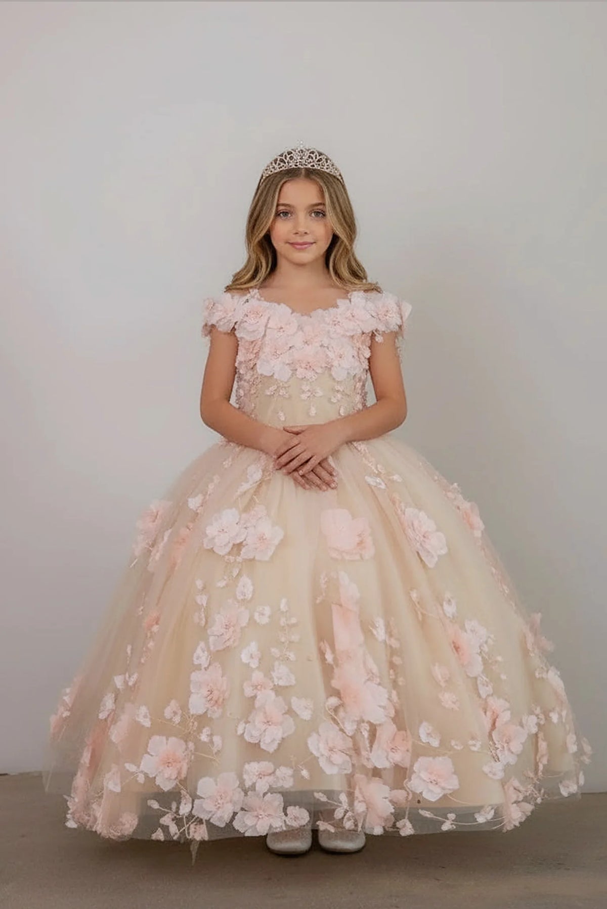 Delicate accents highlight, the Blush Pink mini quince dress showcases bold floral embroidery from bodice to hem and full tulle skirt with dimensional appliqué.