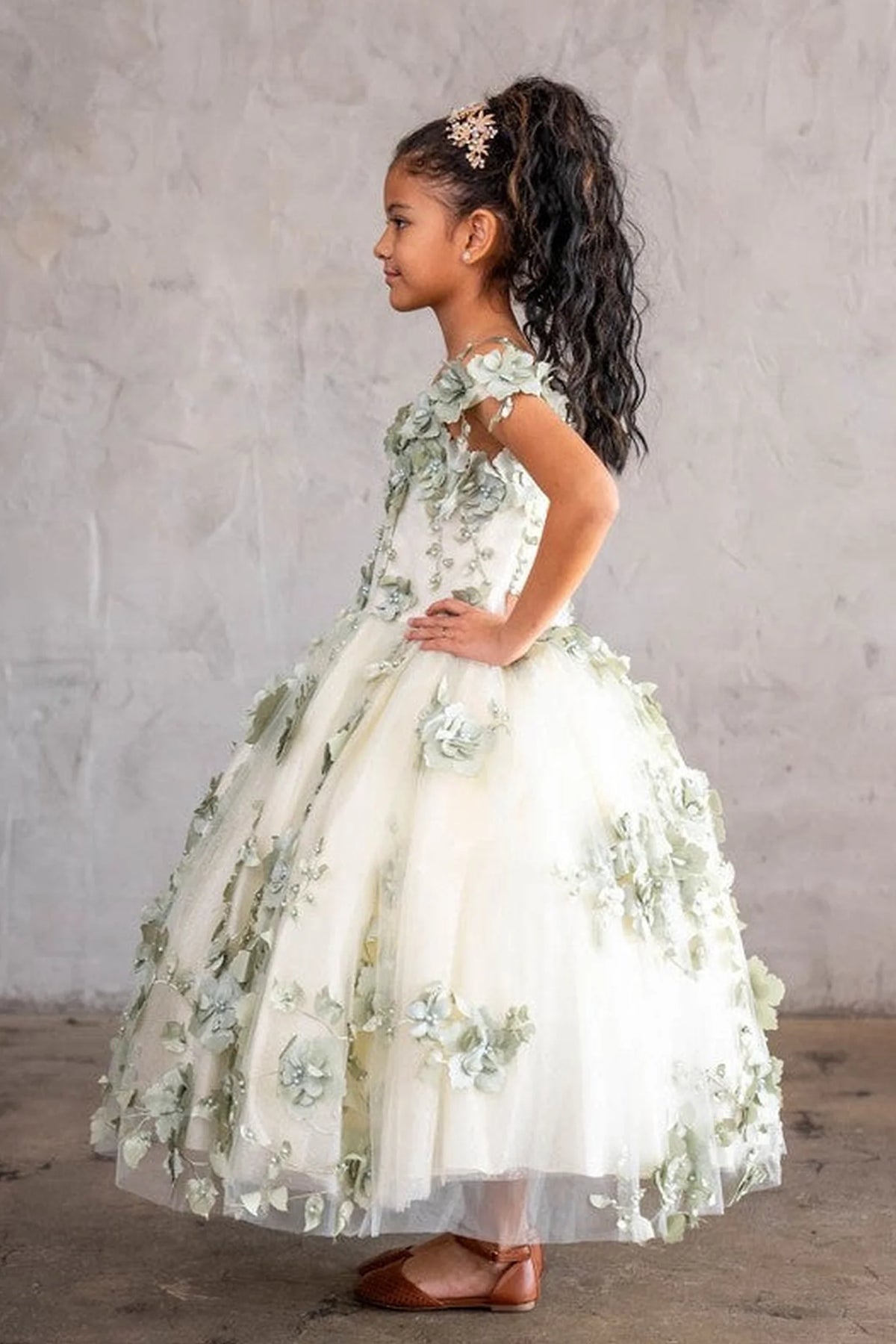The additional image shows full tulle skirt with dimensional appliqué on the Sage mini quince dress.