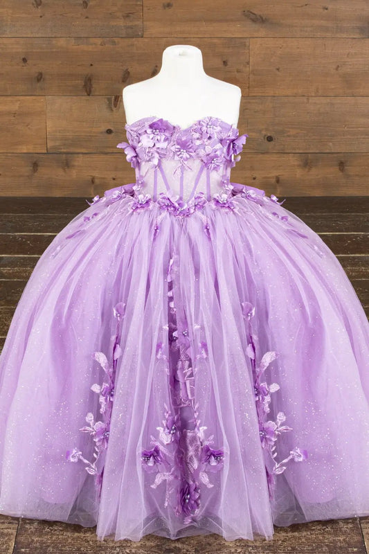 Front-facing view of lilac mini quince dress with 3D floral appliqué bodice, glitter tulle detailing, and sweetheart neckline.
