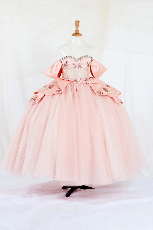 Front-facing display of a stunning lilac mini quince dress featuring a 3D floral appliqué bodice with beaded fringe detail and a glitter tulle layered skirt.