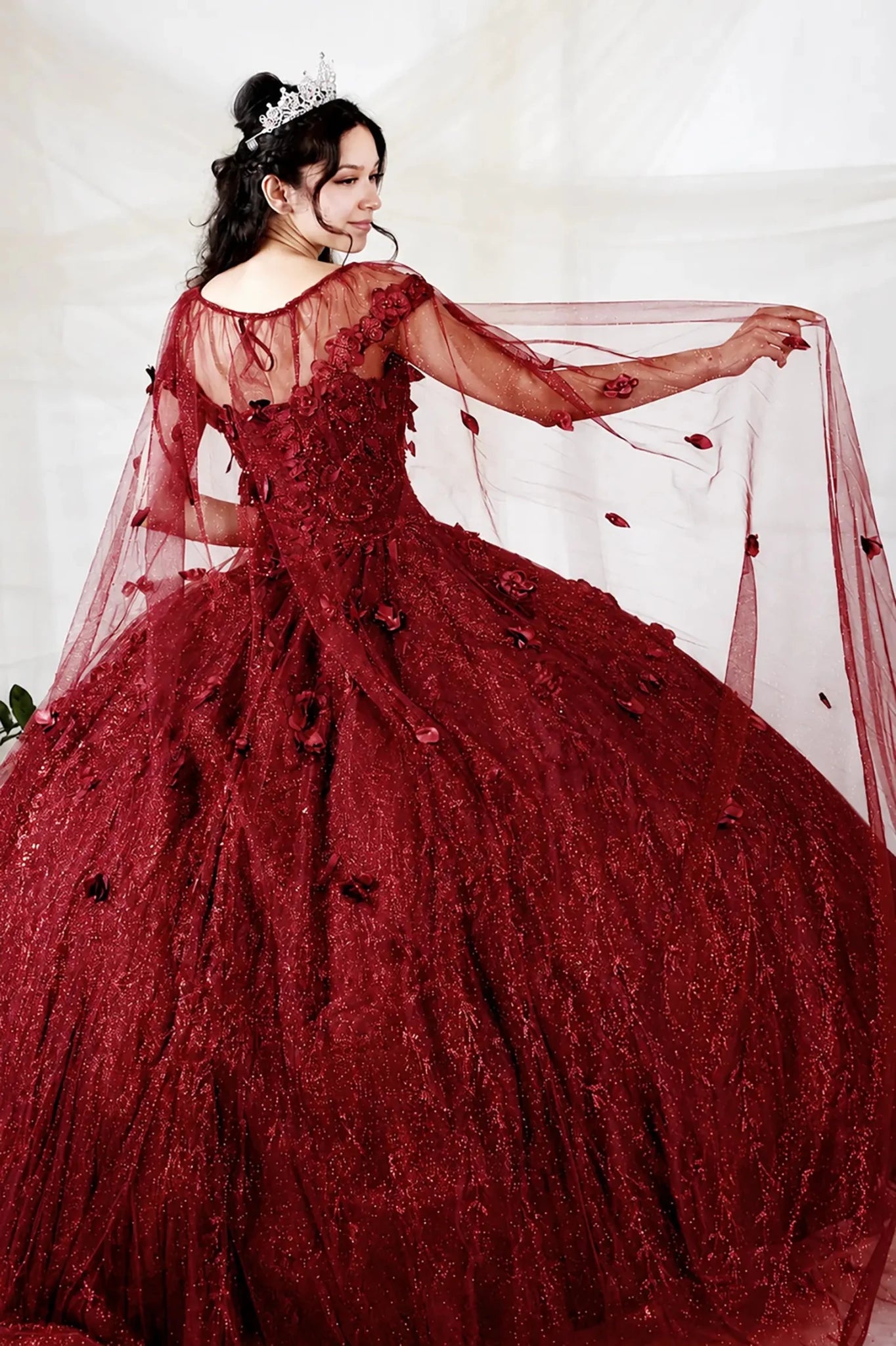Burgundy quinceañera ball gown with 3D floral applique and detachable sheer flowing cape