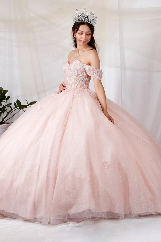 Side View of a woman wearing Soft pink gown with butterfly appliqués contoured bodice and airy layered skirt