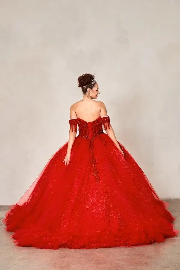 Back-Facing of a woman wearing Red formal gown featuring layered ruffle skirt structured back and flowing silhouette