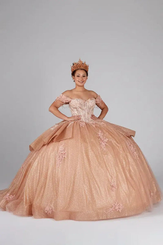 Front-Facing of a woman wearing Rose gold formal gown featuring lace-up back ruffled skirt overlay and chapel train