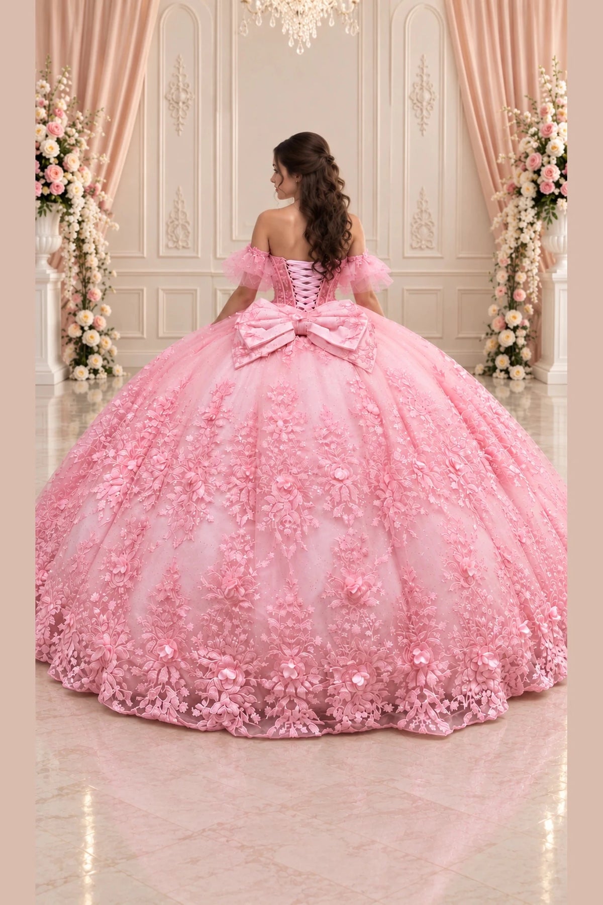 An oversized bow and lace-up closure accent the back of this Blush Pink (Blush/Pink) quinceañera dress.