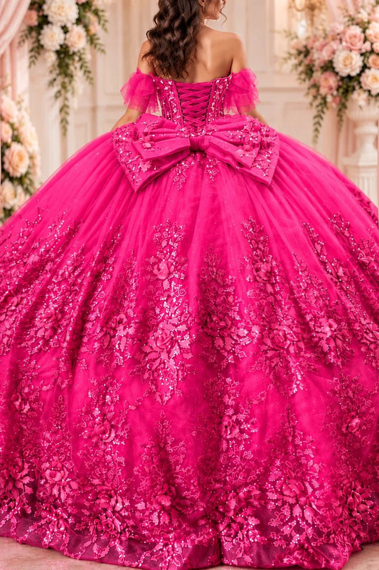 An oversized bow accents the lace-up back of this Fuchsia quinceañera dress.