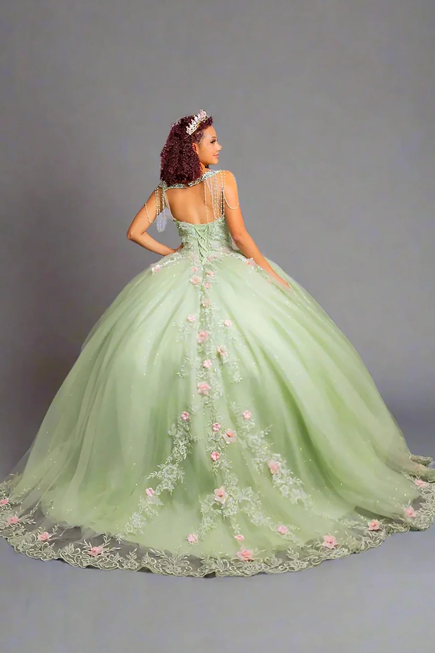 Blue quinceañera ball gown with luminous glitter mesh underlayer enhancing voluminous silhouette and lace back up