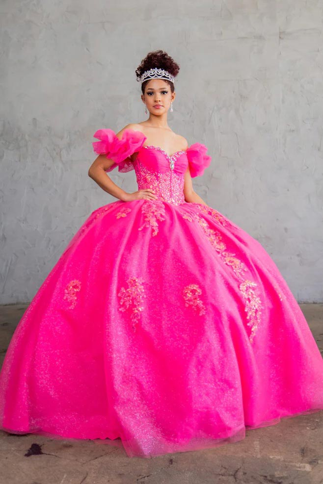 Hot pink quinceañera ball gown with illusion sweetheart bodice, corset boning, ruffled sleeves and sparkling embroidery