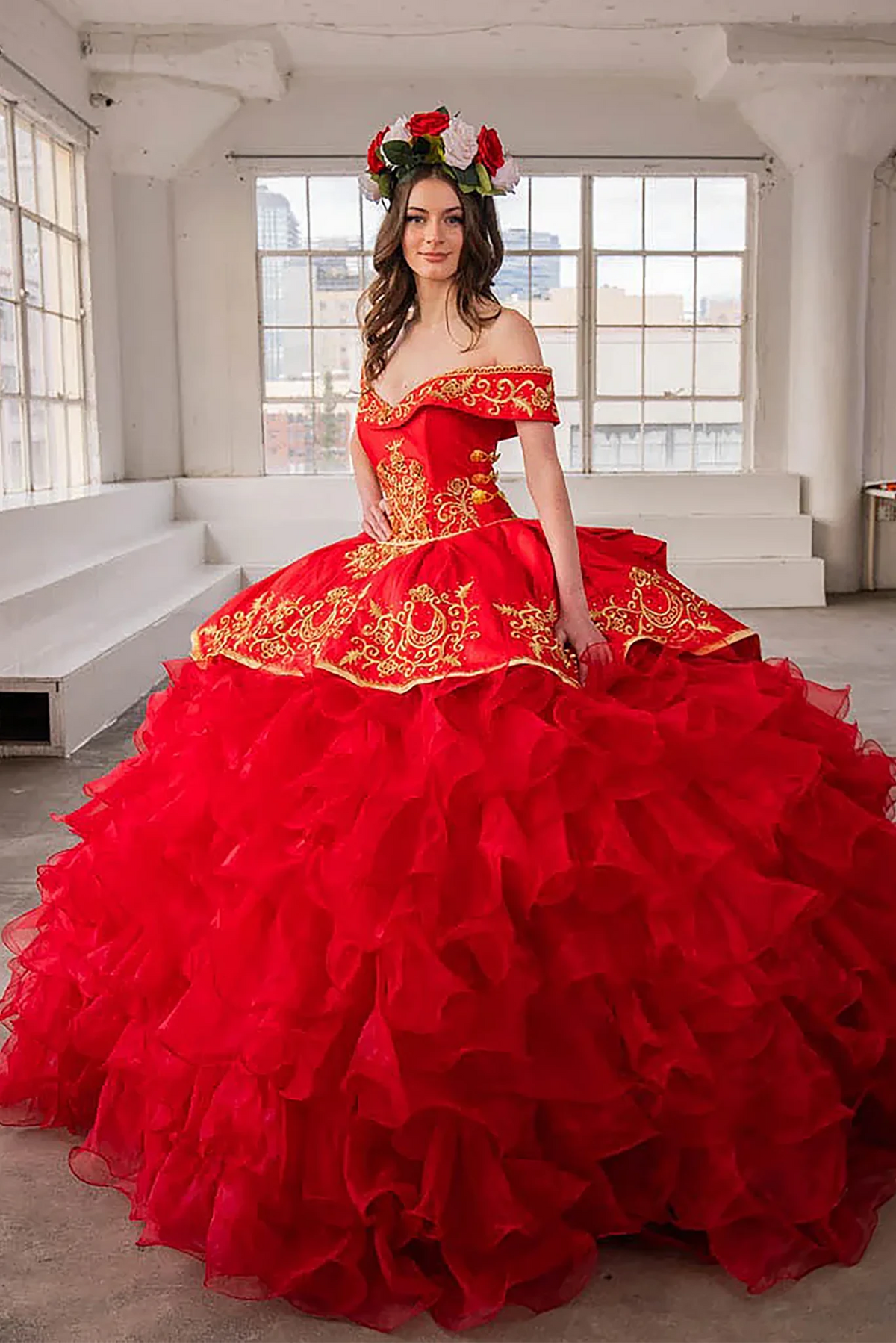 Red quinceañera ball gown with gold embroidery, charra ruffle design and beaded bodice