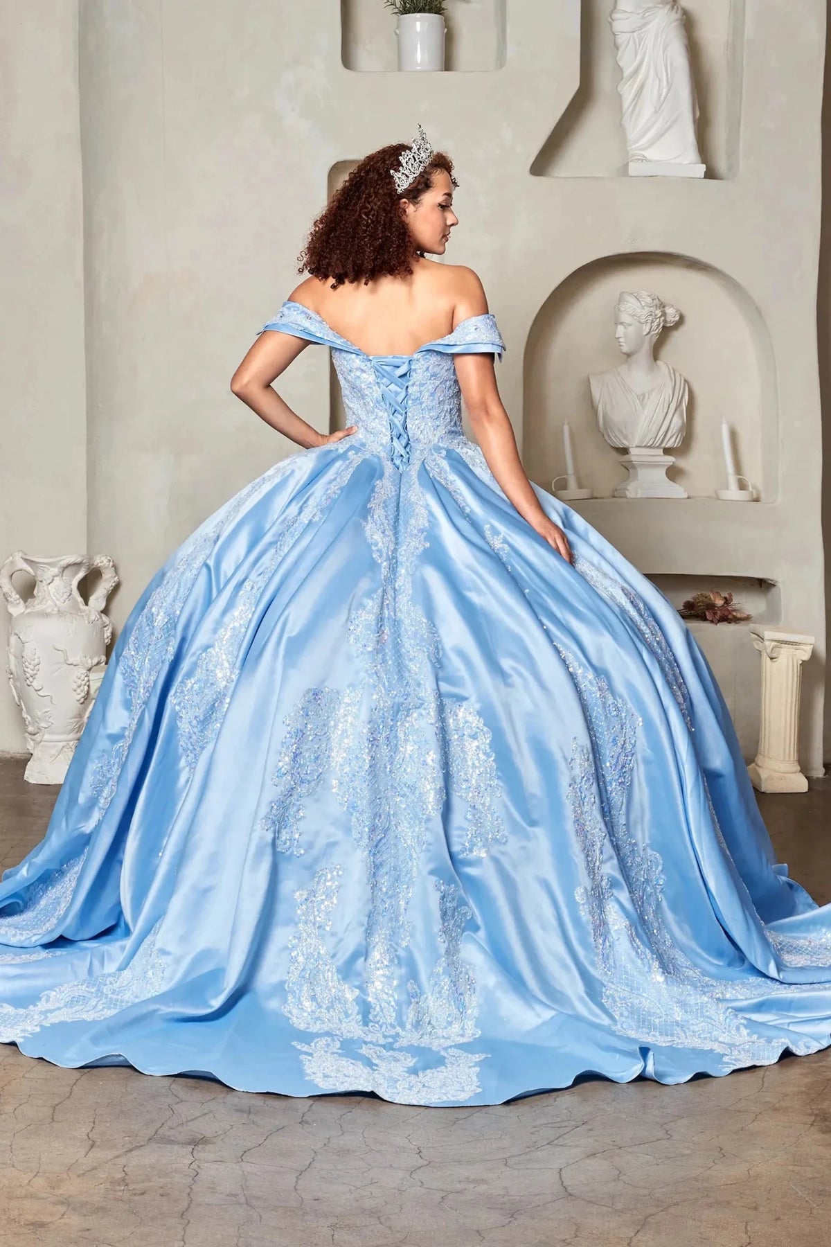 Light blue satin quinceañera ball gown with crystal beaded bodice, embroidery and train