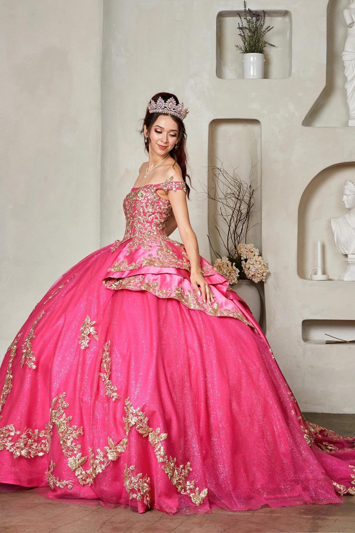 Fuchsia quinceañera ball gown with beaded glitter layered skirt, ornate gold embroidery and satin train