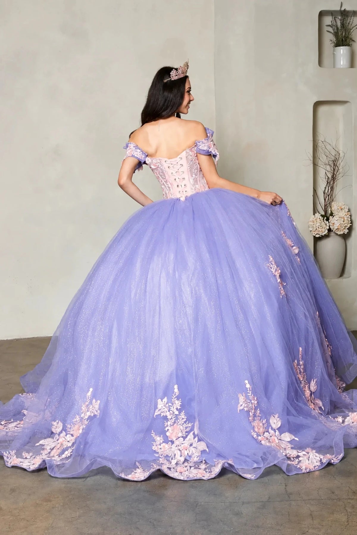Lilac quinceañera ball gown with blush floral embroidery, crystal beaded bodice and lace‑up back
