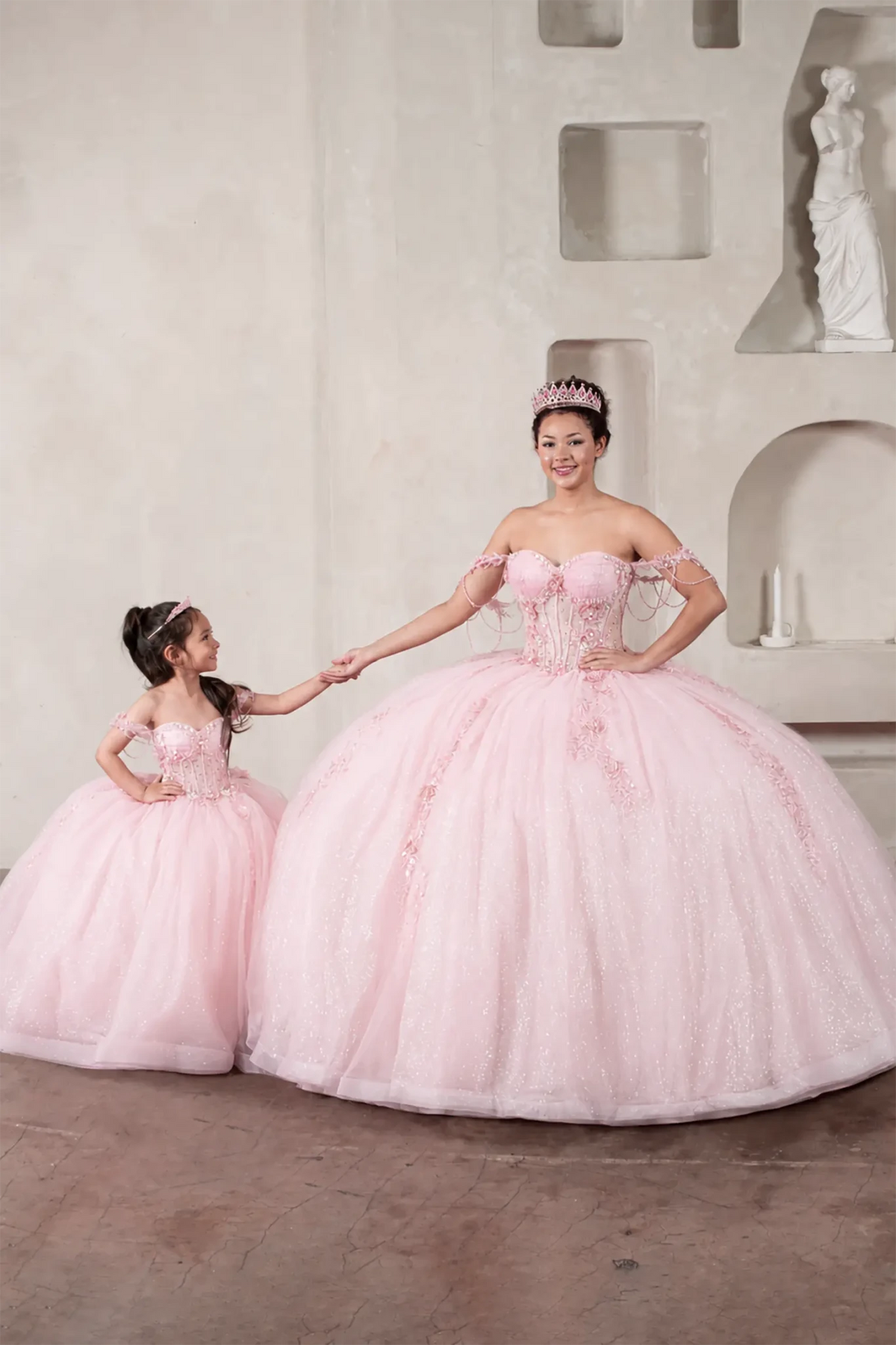 Blush quinceañera ball gown with sheer corset bodice, 3D floral embroidery, detachable bow and sparkle tulle