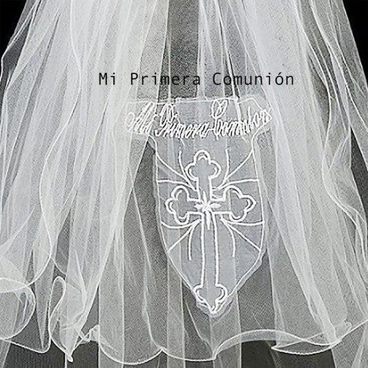 White communion veil with cross design and text 'Mi Primera Comunion' on a black background