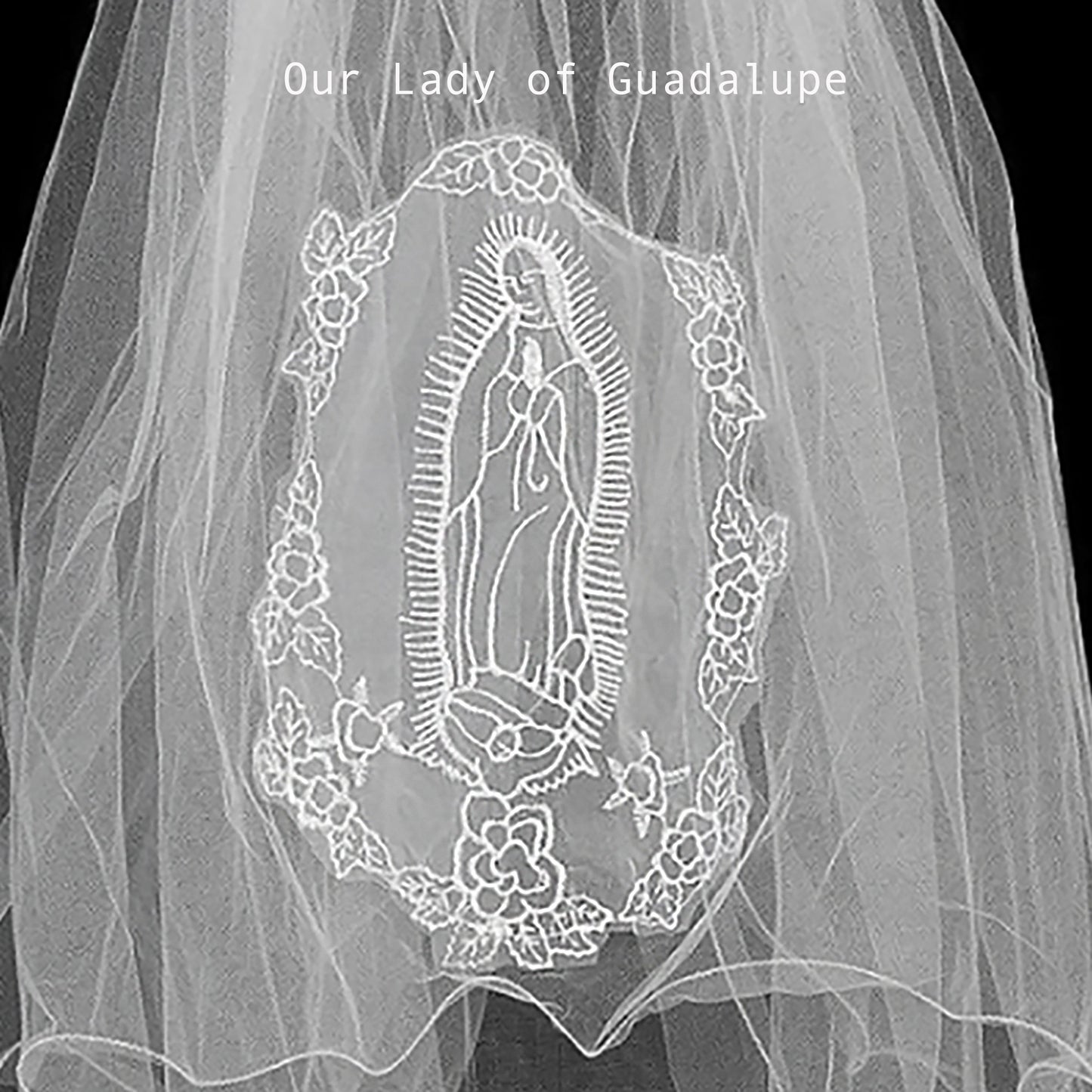 applique with embroidered design of Our Lady of Guadalupe on a plain background