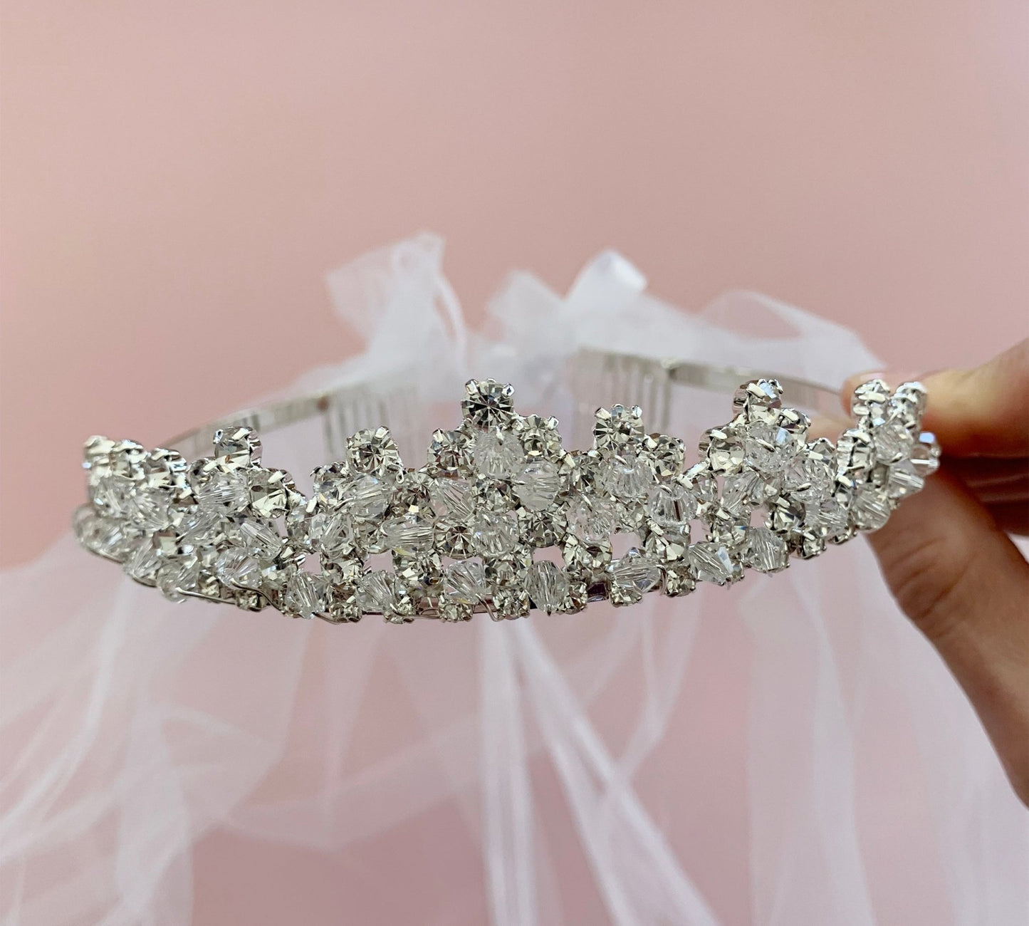 White rhinestone flower girl and first communion tiara and two-tier veil.