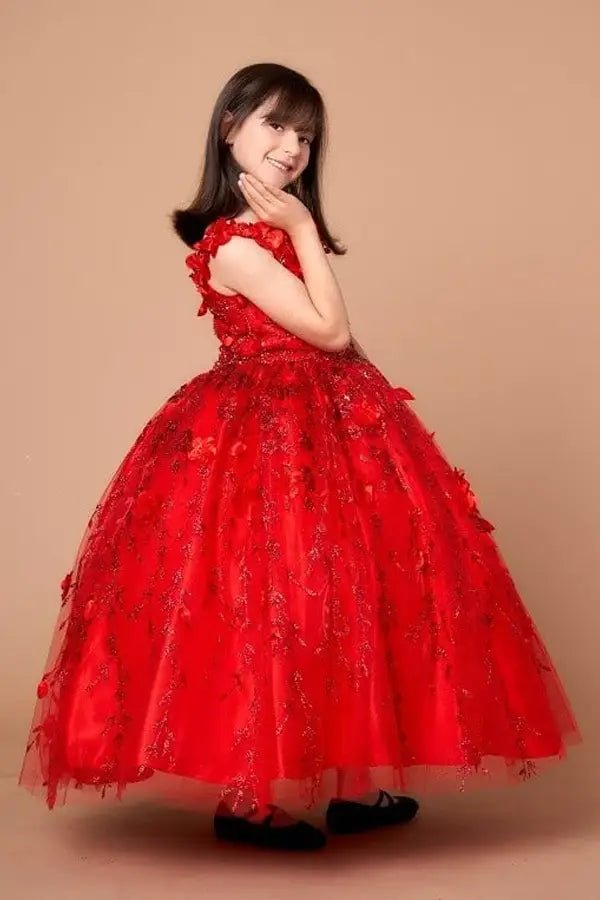 Side view of red mini quince dress with dimensional 3D floral detail, shimmering glitter highlights, and flowing layered tulle skirt.