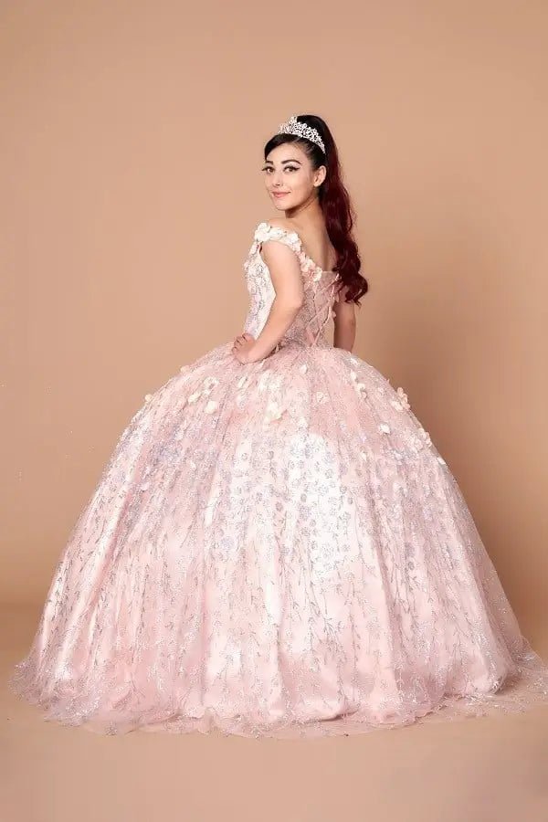 Blush quinceañera ball gown with off‑shoulder neckline, delicate floral applique and flowing skirt