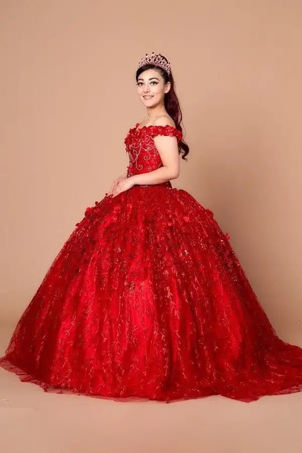 Red quinceañera ball gown with off‑shoulder neckline, floral applique and flowing skirt