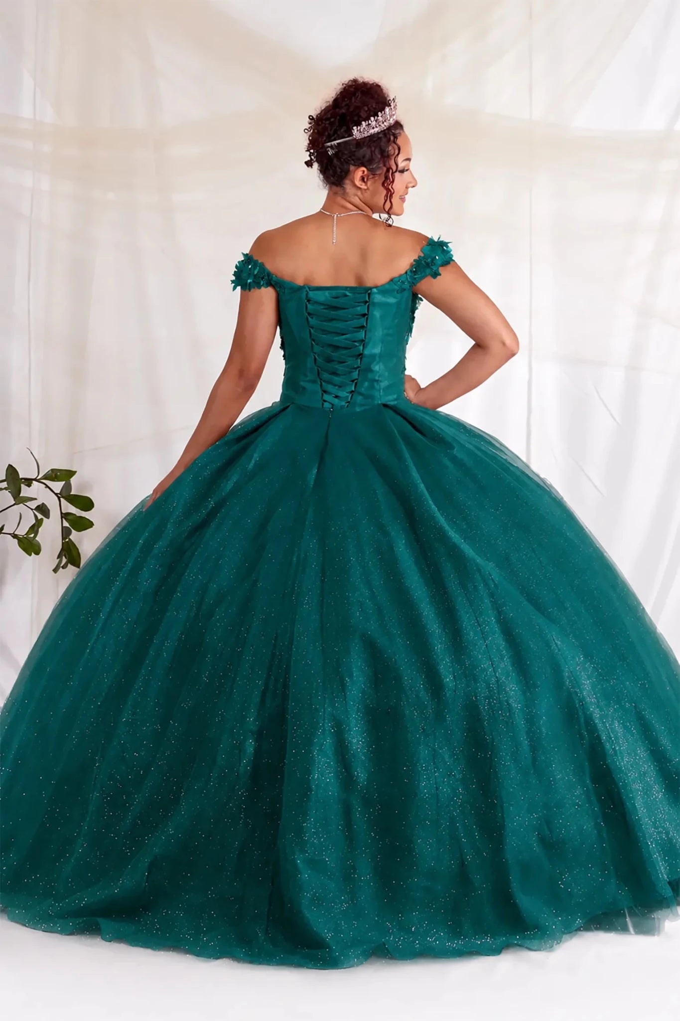 green quinceanera ball gown with off-shoulder and lace up design