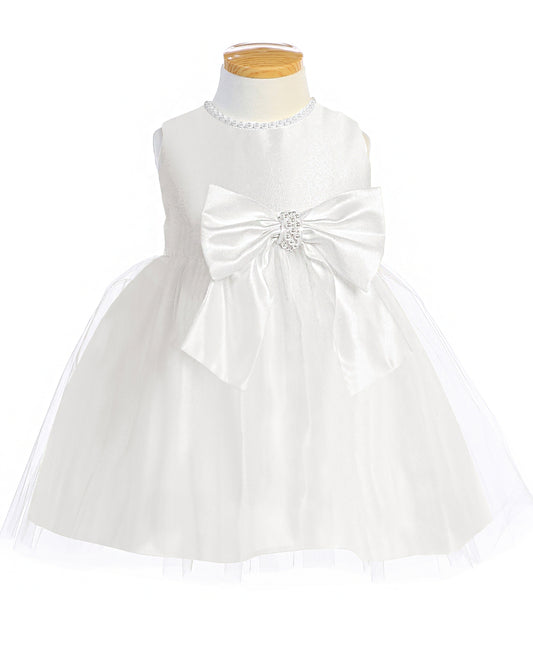 White dress with a large bow on a mannequin against a white background