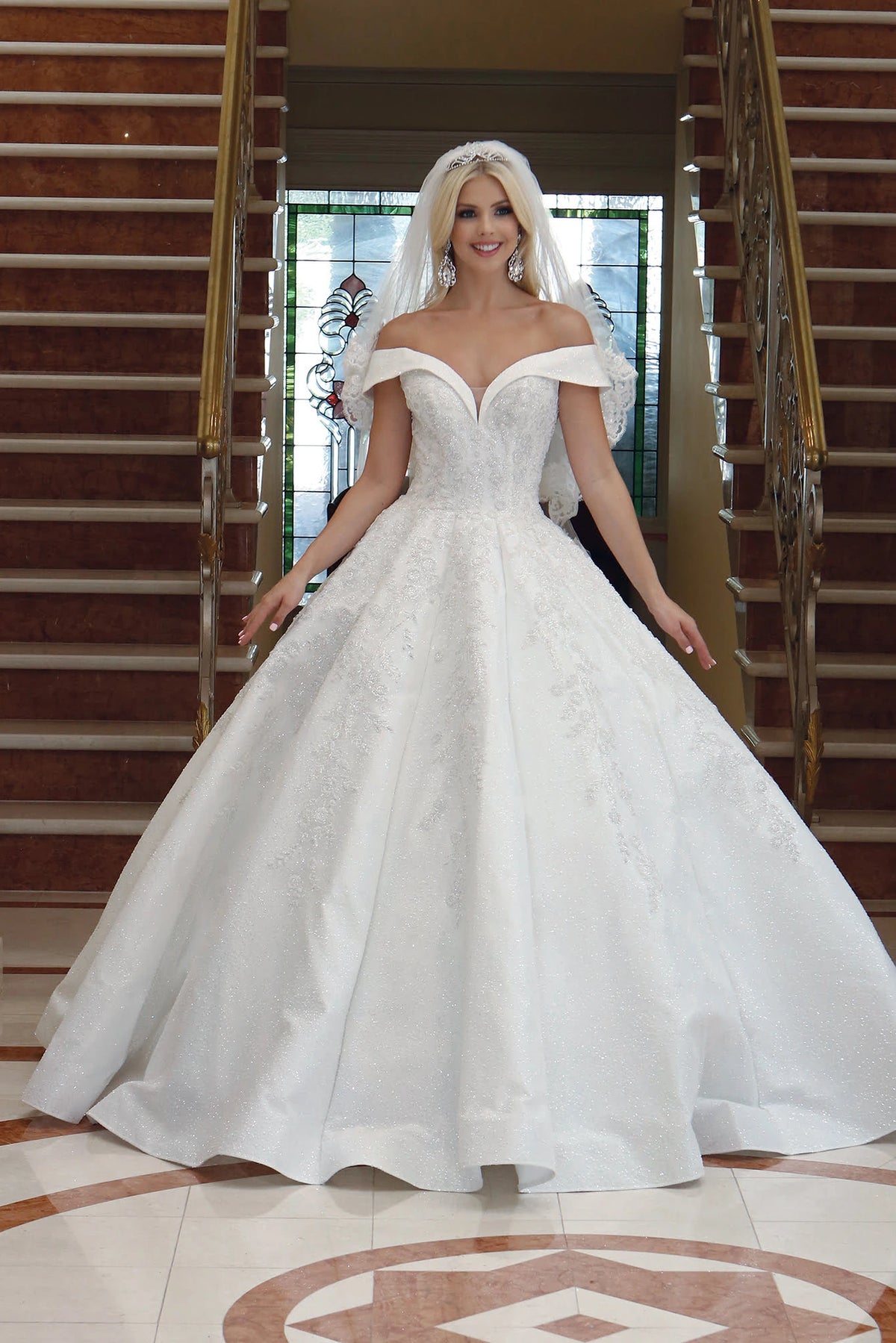 Featuring a floor-length skirt, this Off-White wedding dress is shown in full view.
