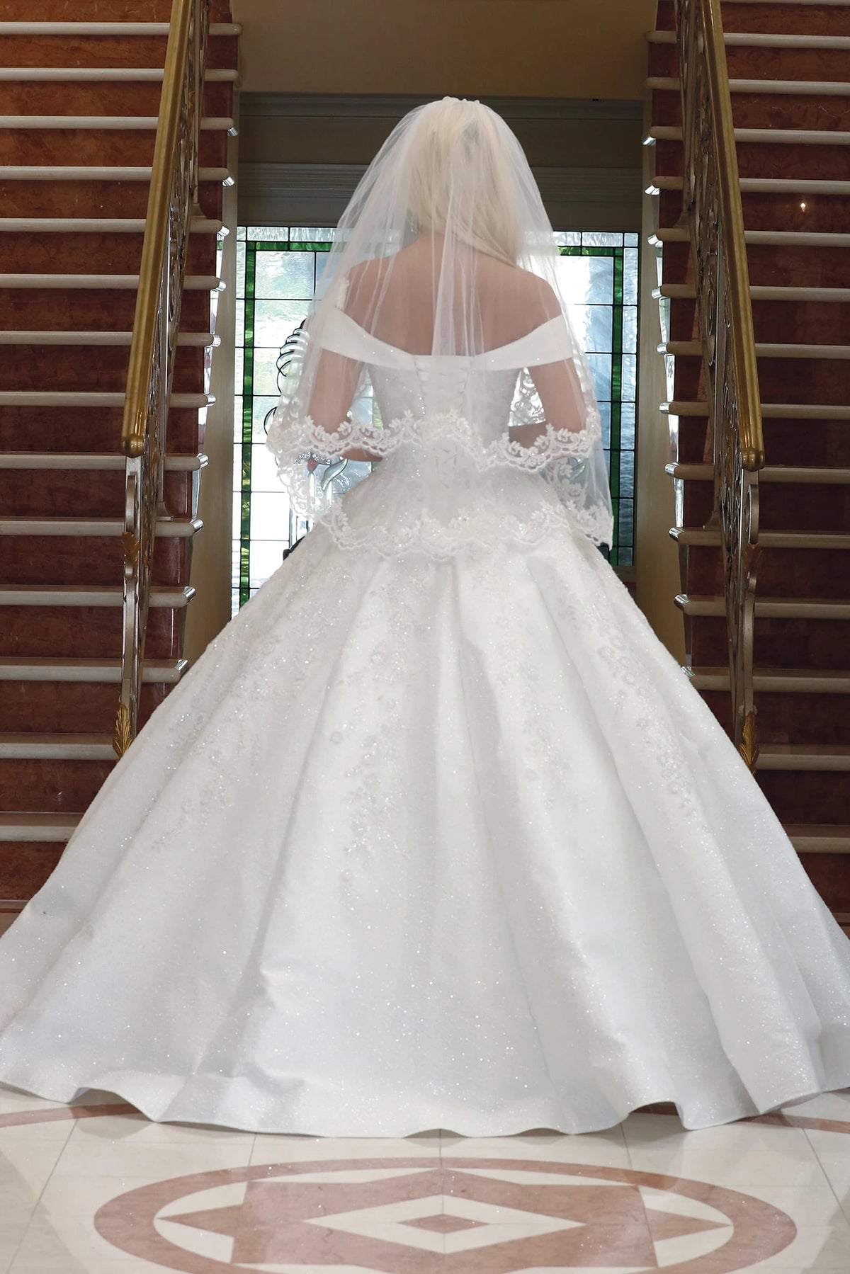 From the back, the Off-White wedding dress reveals its floor-length skirt.