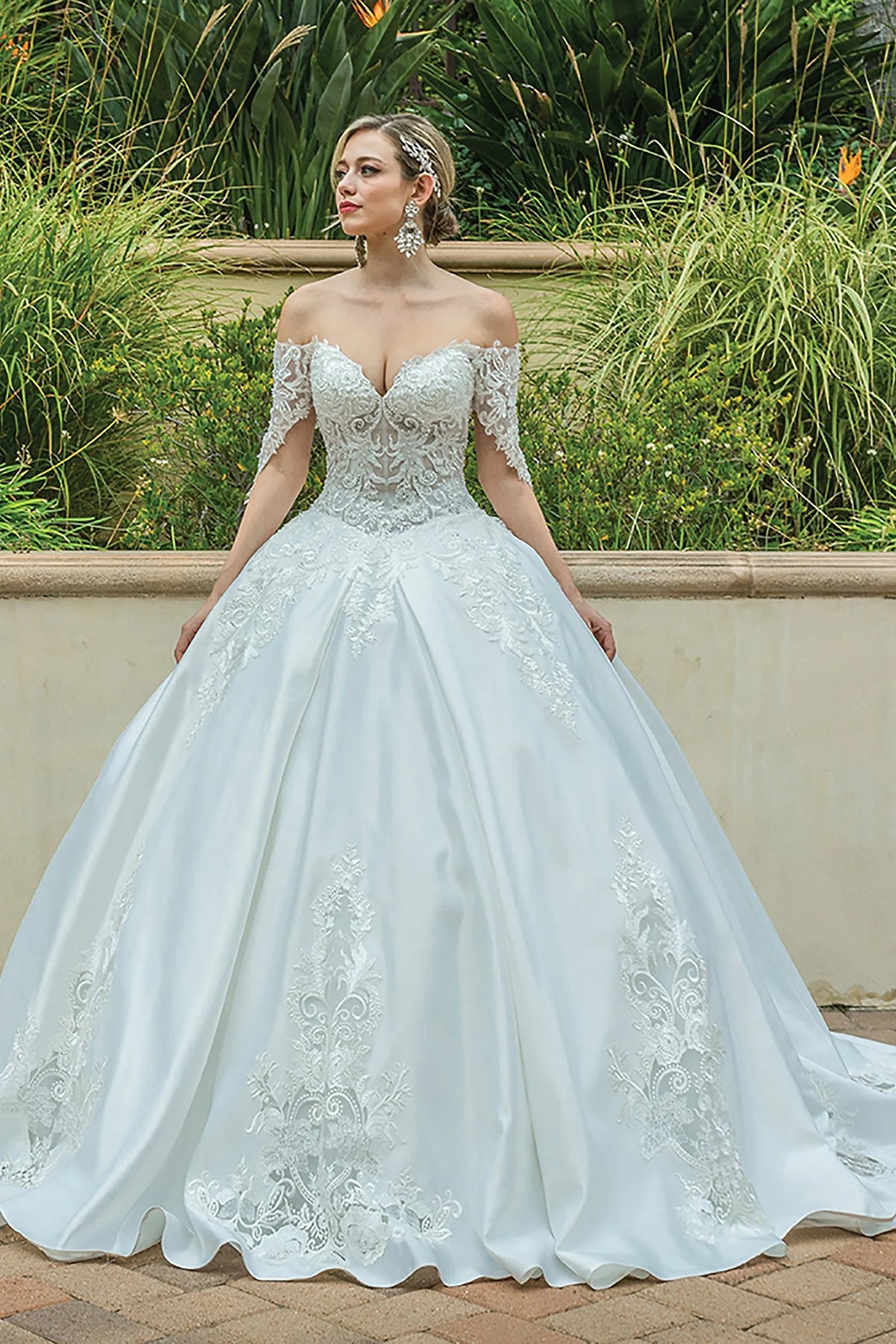 Featuring a floor-length skirt, this Off-White wedding dress is shown in full view.