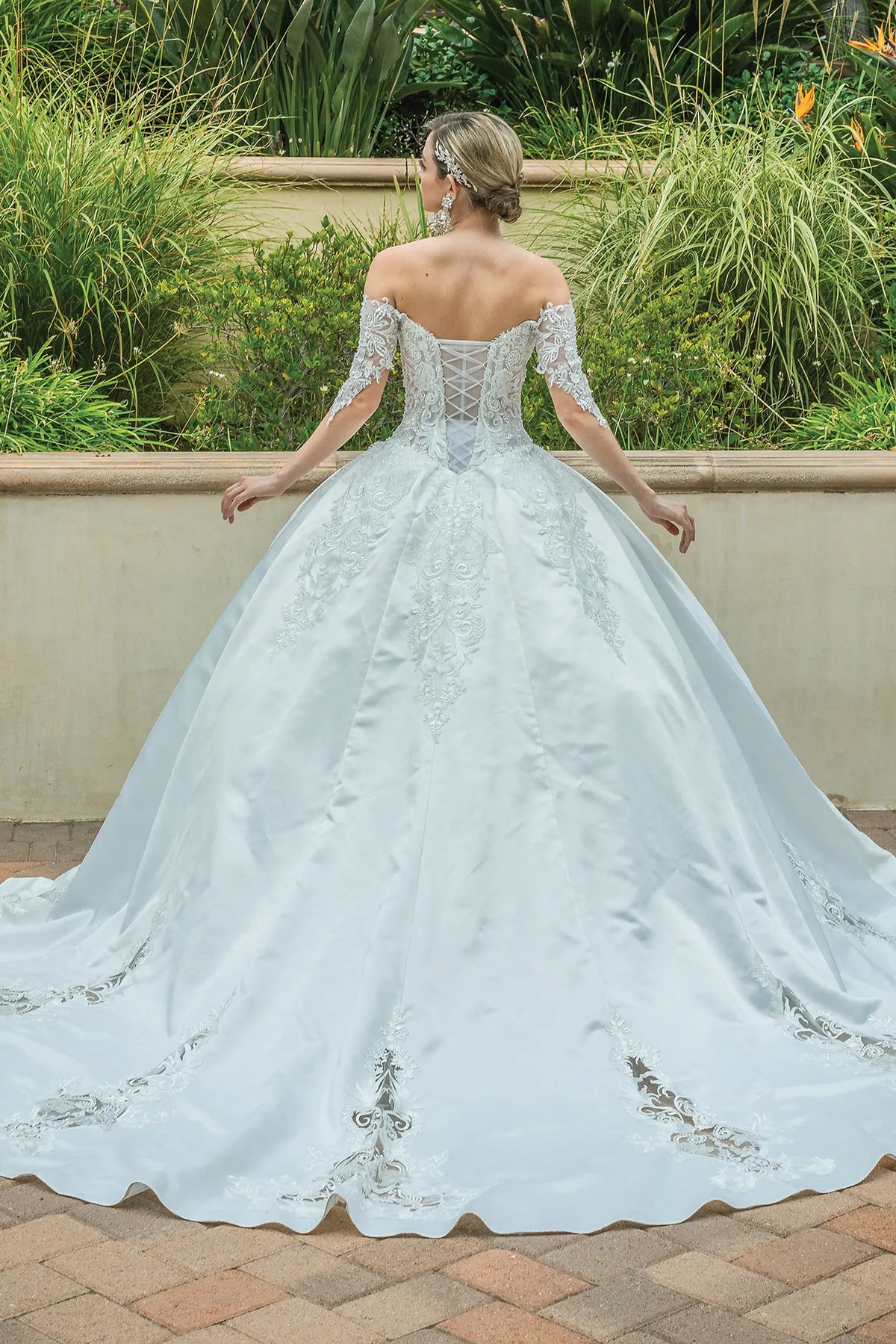 From the back, the Off-White wedding dress reveals its floor-length skirt.