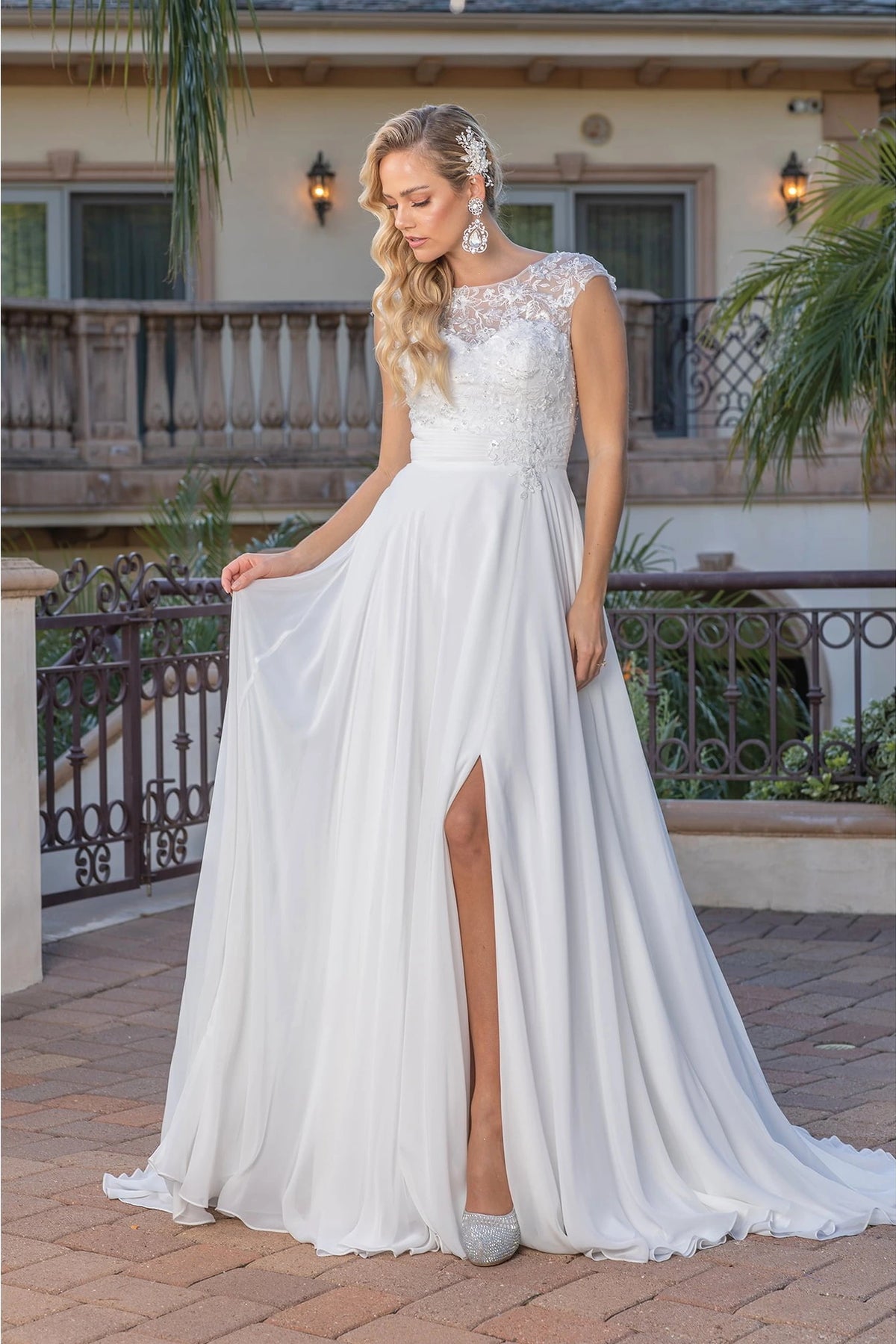 Featuring a floor-length skirt, this Off-White wedding dress is shown in full view.