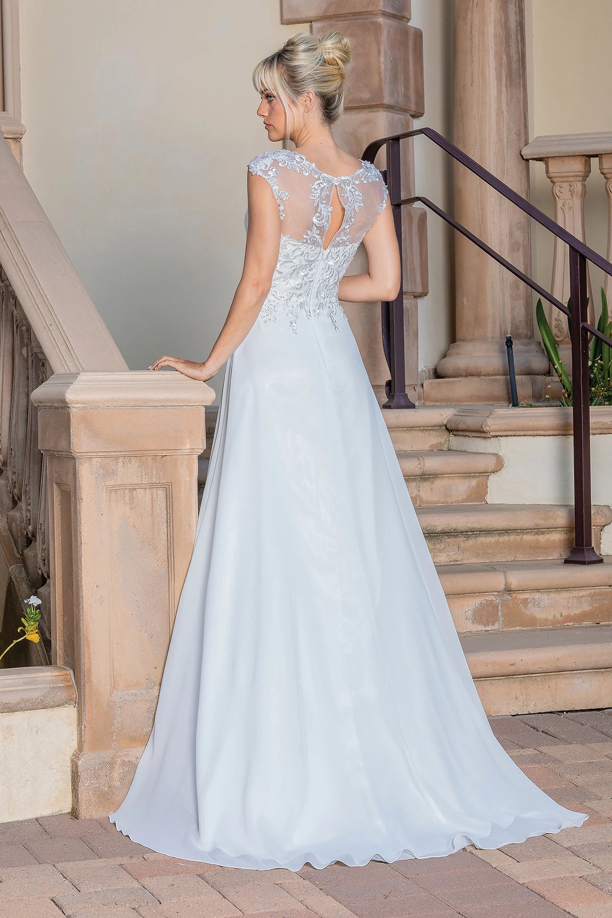 From the back, the Off-White wedding dress reveals its floor-length skirt.