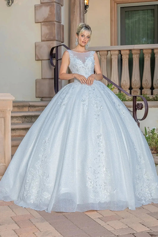 Woman in Off white embellished wedding ball gown with scoop neckline.