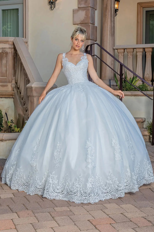 Woman in Off white full-skirt wedding gown with lace bodice and sweeping train.
