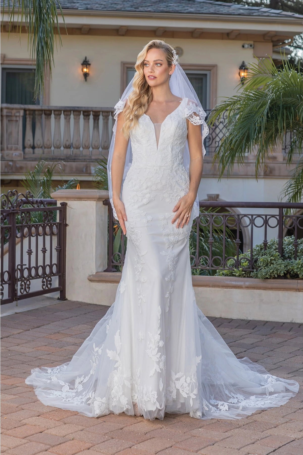 Featuring a floor-length skirt, this Off-White wedding dress is shown in full view.