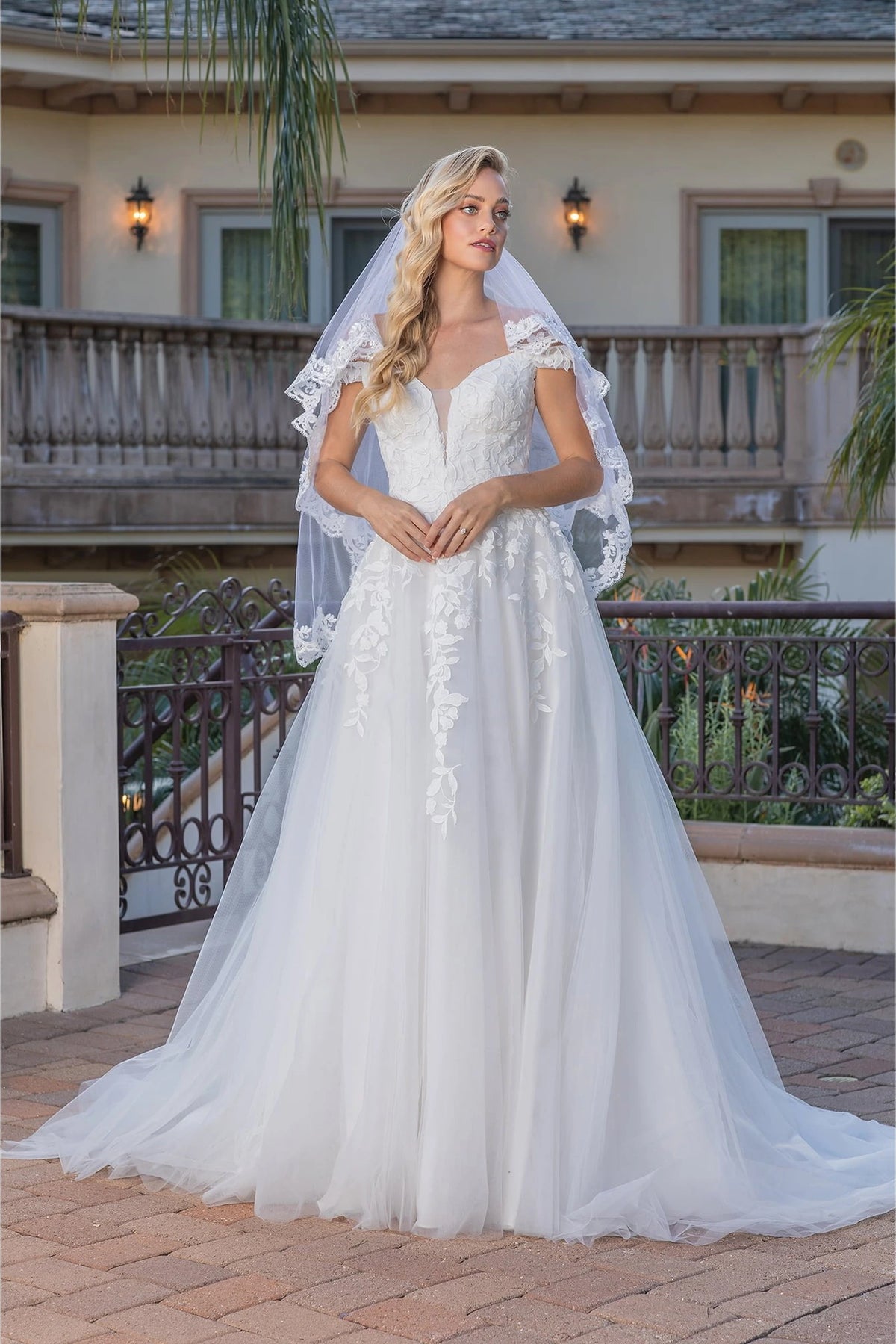 Featuring a floor-length skirt, this Off-White wedding dress is shown in full view.