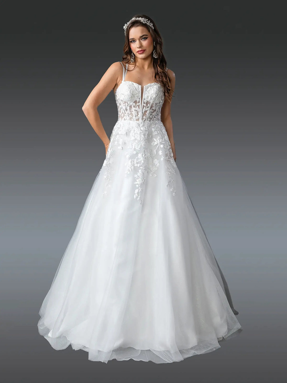 Showing floral embroidery across its sweetheart bodice, this Off-White wedding dress is shown in full view.