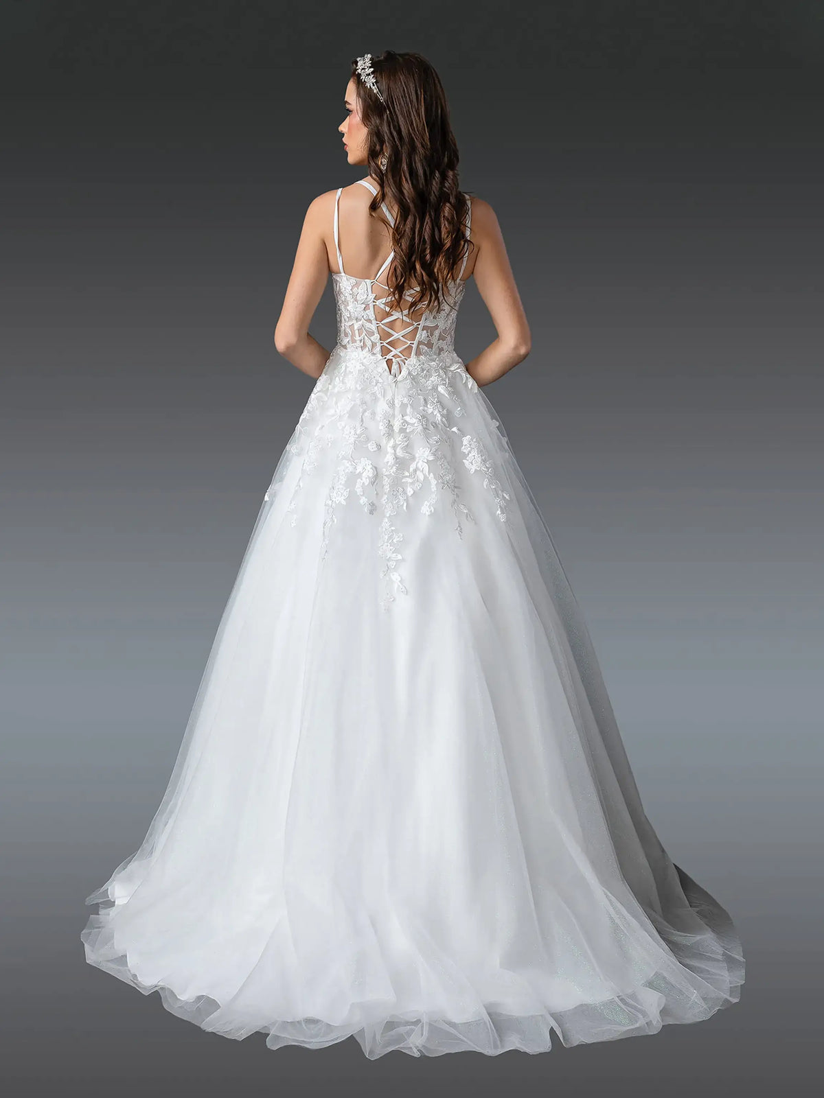Revealing a lace-up bodice above its flowing train, this Off-White wedding dress is shown from the back.