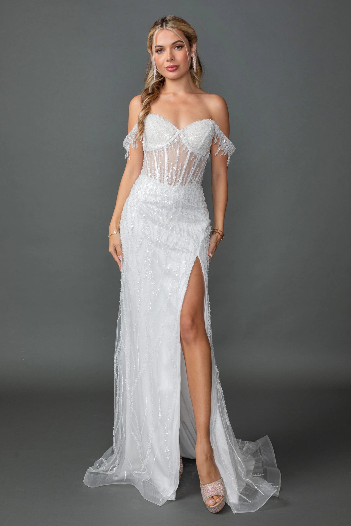 Featuring a floor-length skirt, this Off-White wedding dress is shown in full view.