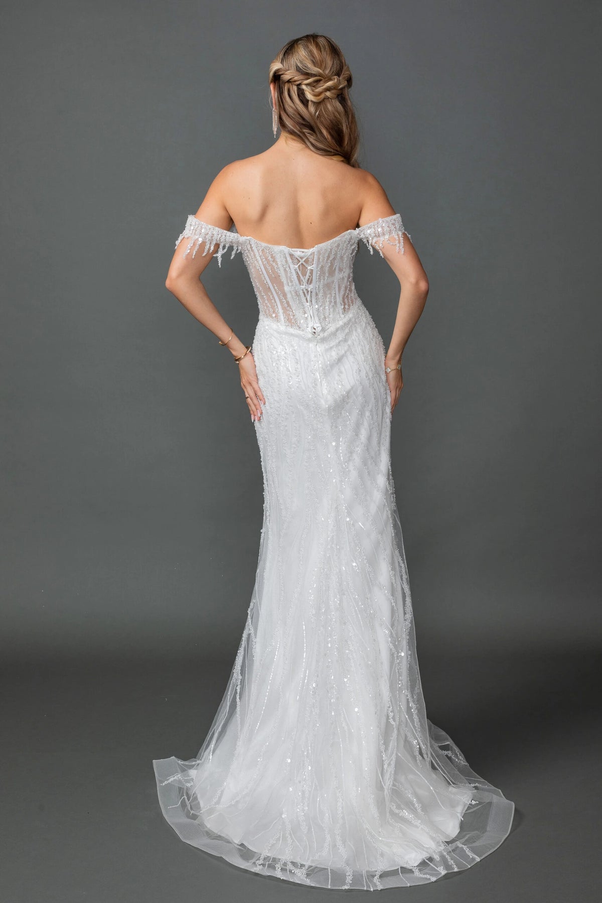 From the back, the Off-White wedding dress reveals its floor-length skirt.