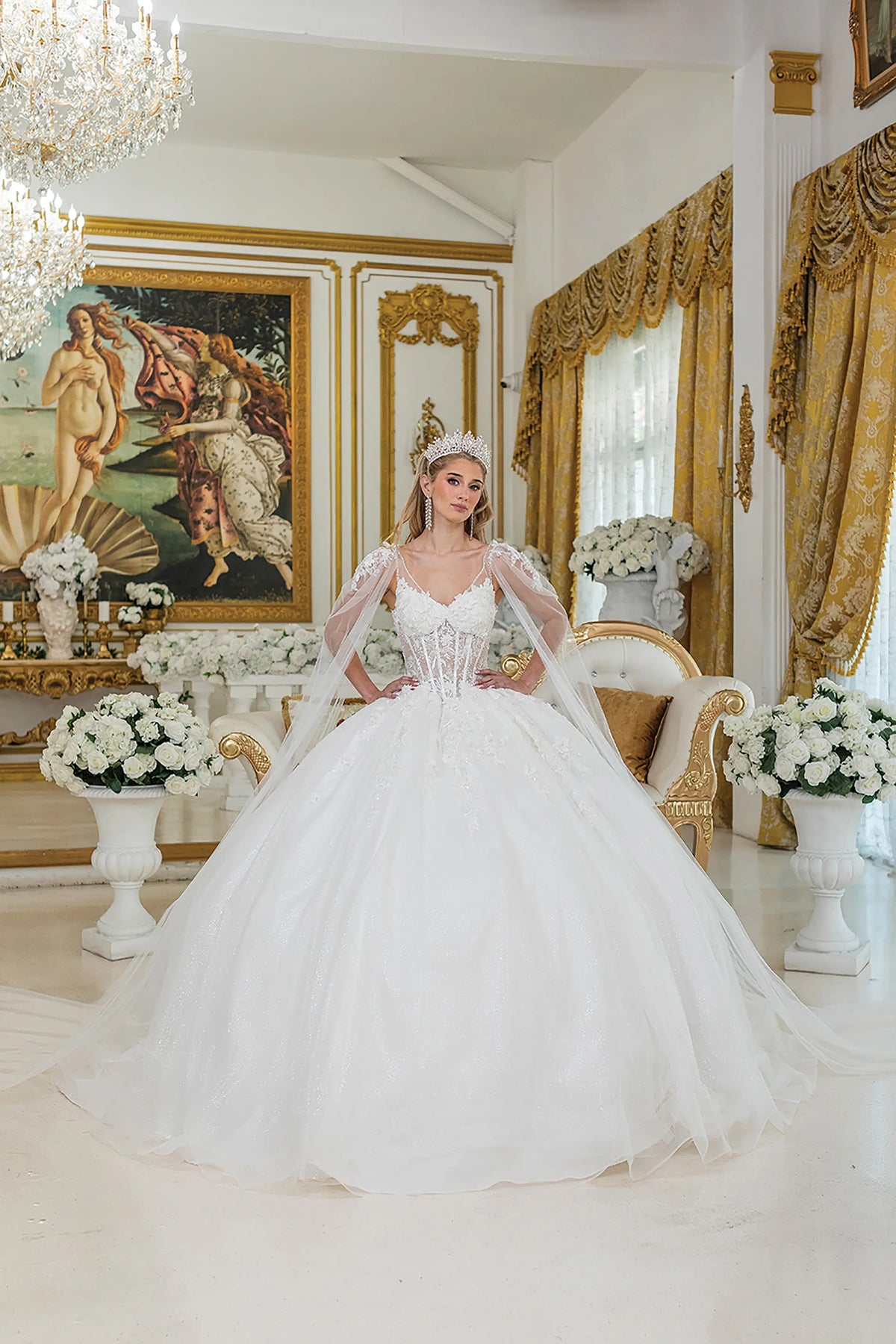 Showing floral appliqués on its full tulle skirt, this Off-White wedding dress is shown in full view.