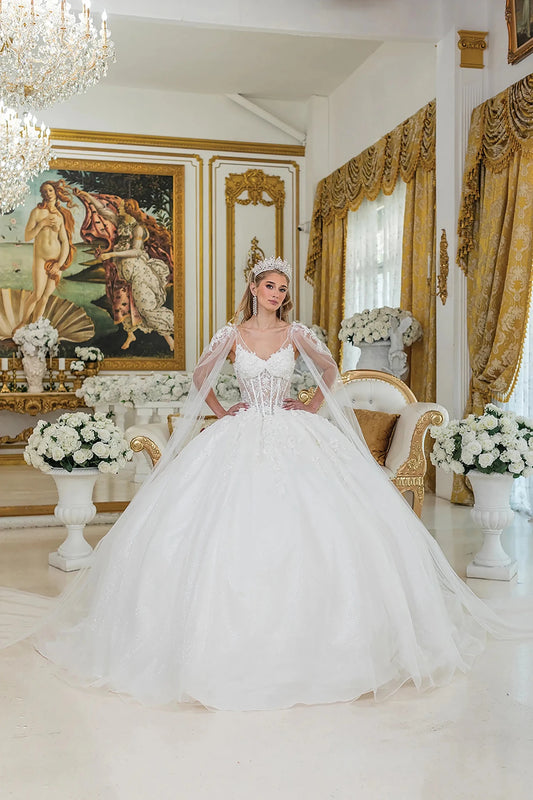 Showing floral appliqués on its full tulle skirt, this Off-White wedding dress is shown in full view.