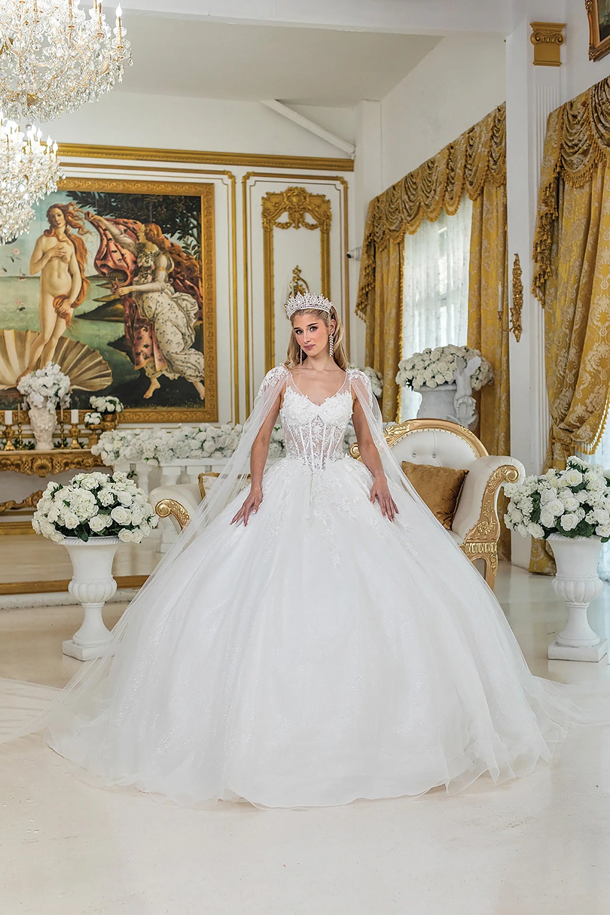 Highlighting detachable sheer sleeves, this Off-White wedding dress shows floral appliqués across its full skirt.