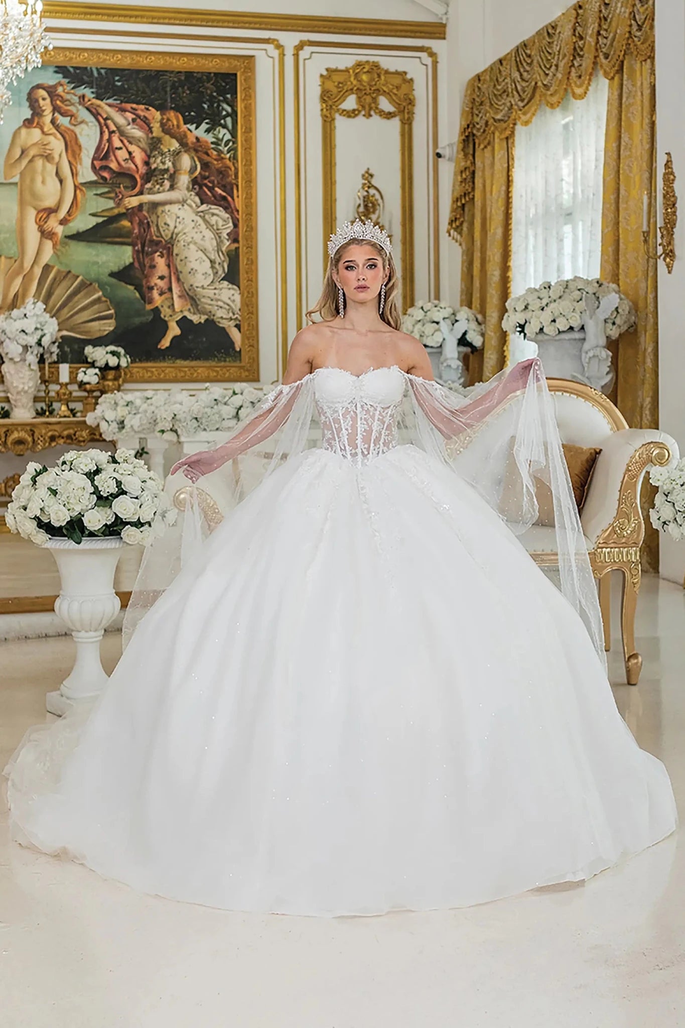 Woman in a white wedding dress standing in an ornate room with decorative elements.