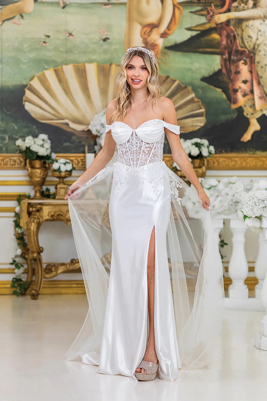 Woman in Off white off-shoulder wedding dress with lace-up back and flowing train.
