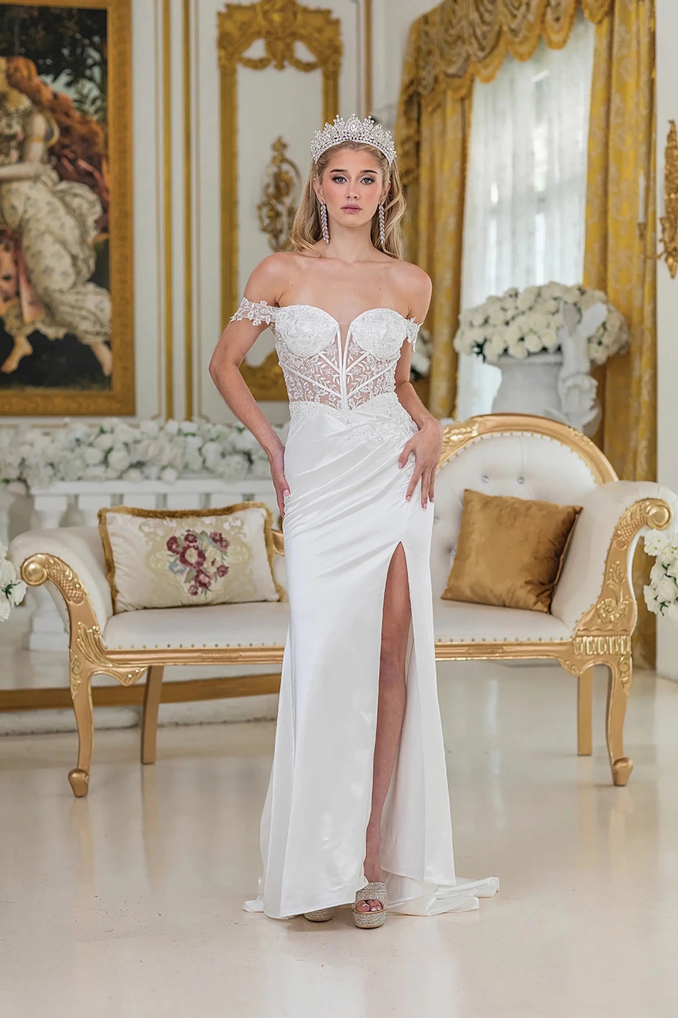 Woman in Off white satin wedding dress with sheer corset and high slit.