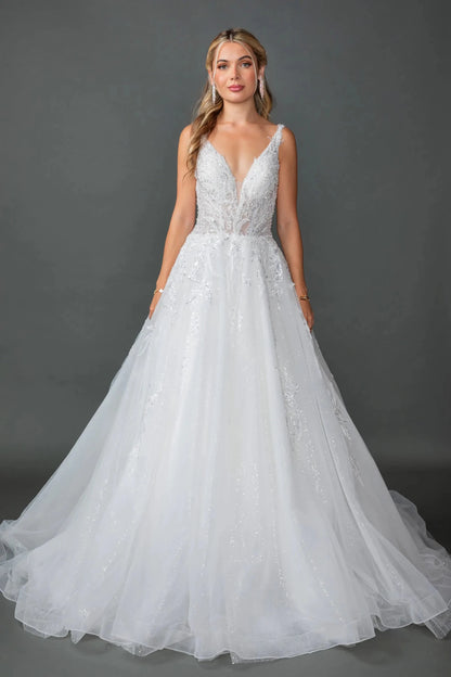 Woman in Off white wedding ball gown with sheer puff sleeves and glitter tulle skirt.