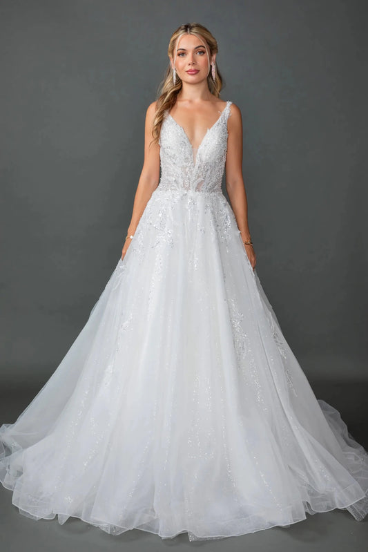 Woman in Off white wedding ball gown with sheer puff sleeves and glitter tulle skirt.