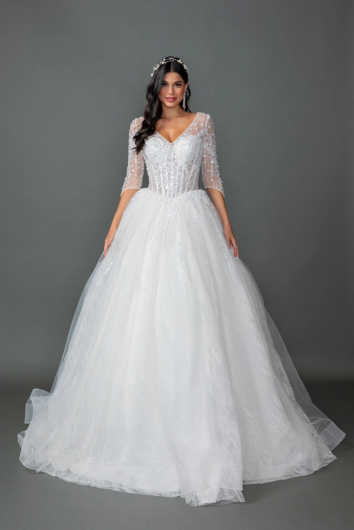 Featuring a floor-length skirt, this Off-White wedding dress is shown in full view.
