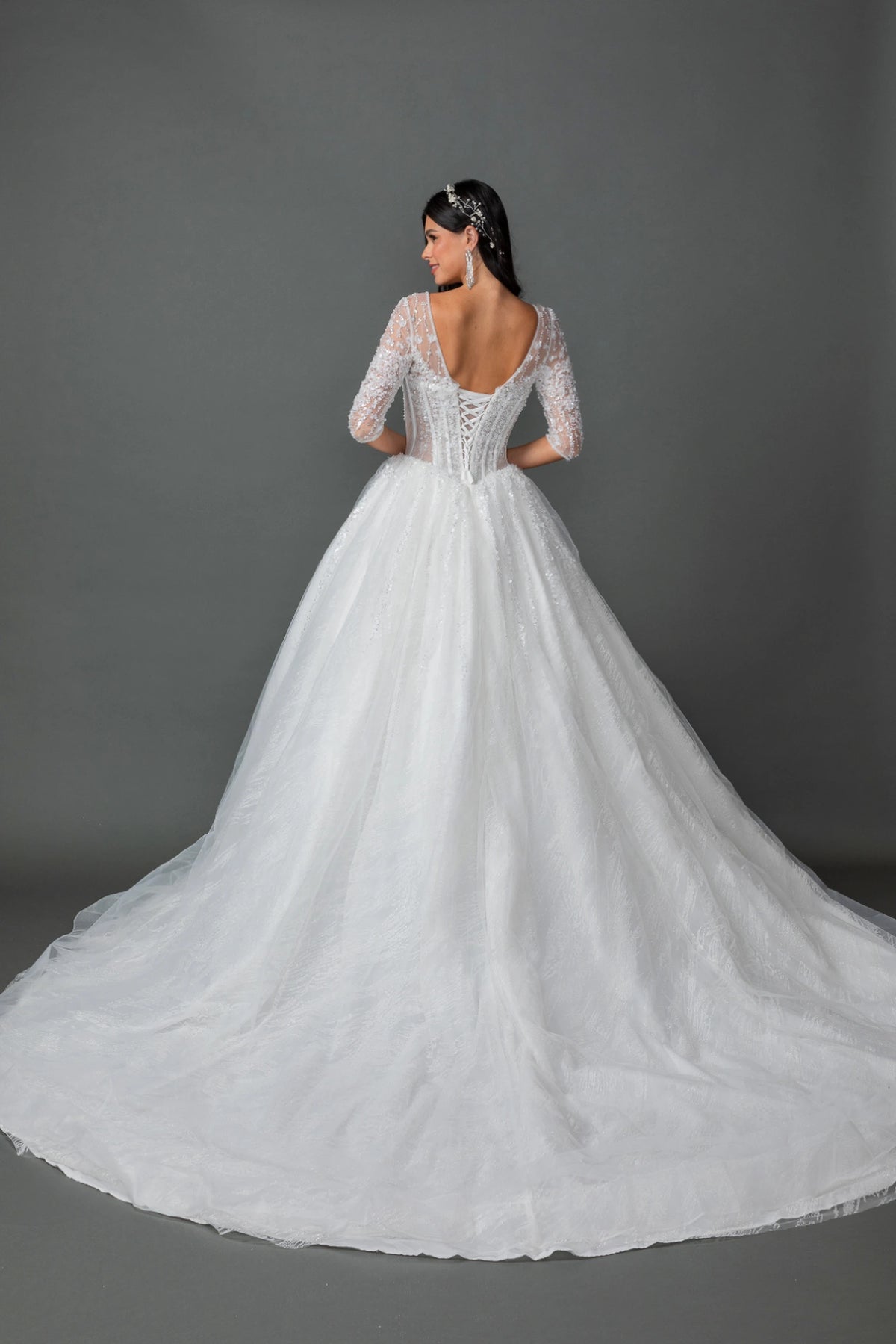 From the back, the Off-White wedding dress reveals its floor-length skirt.
