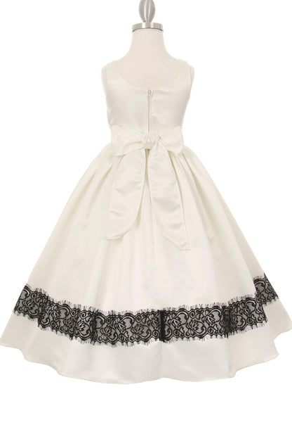 A Ivory flower girl dress showing sash bow and zipper at the back.